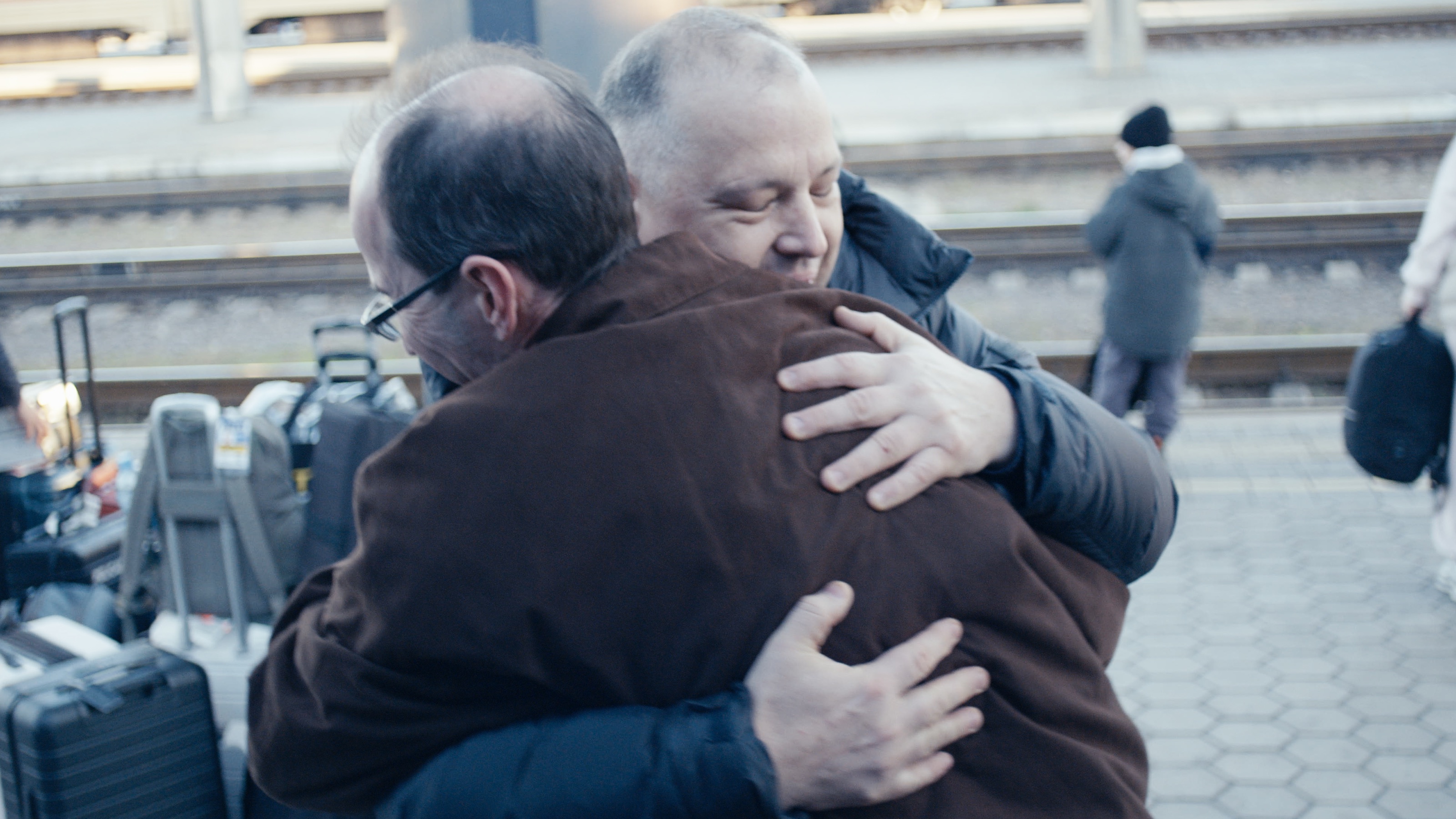 Alex and Andrii greet each other at the station.